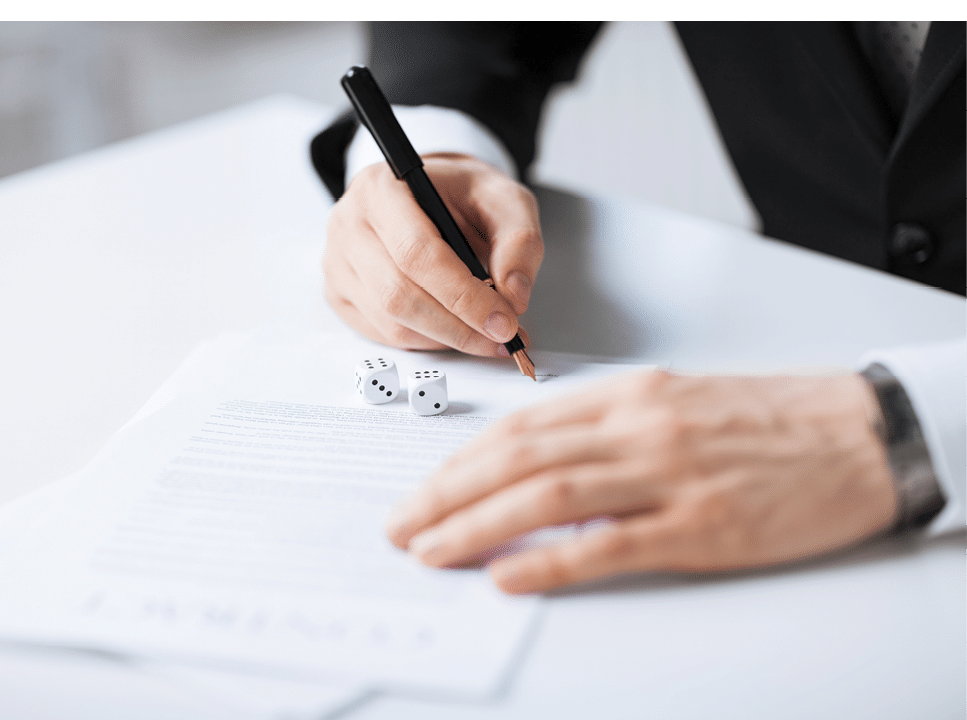 picture of man hands with gambling dices signing contract