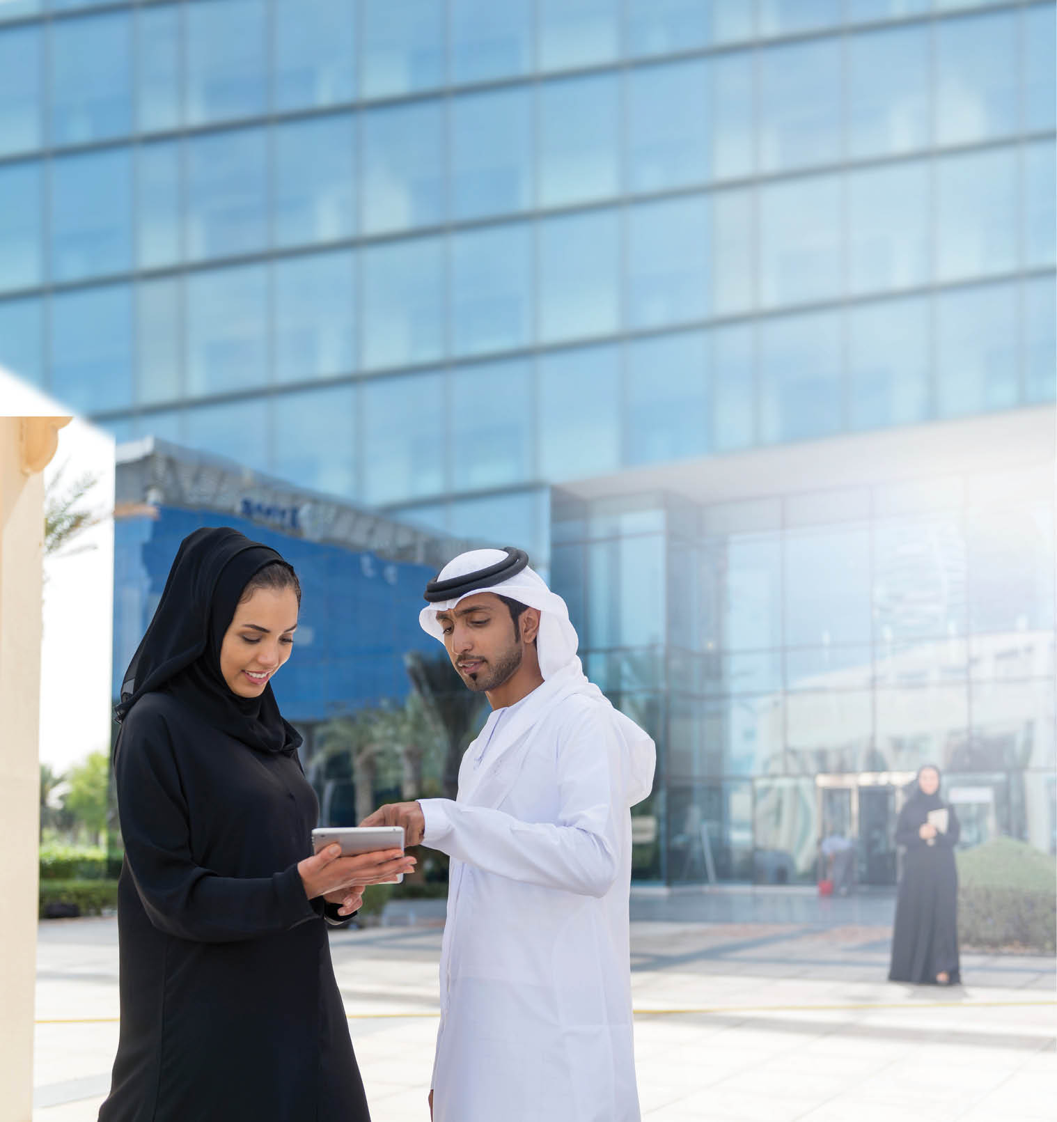 Two Emarati Business people talking outside the office.