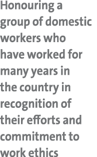 Honouring a group of domestic workers who have worked for many years in the country in recognition of their efforts a...