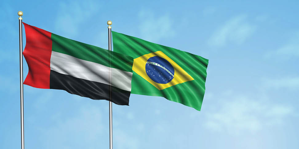 UAE flag with brazil flag, 3D rendering with a cloudy blue sky