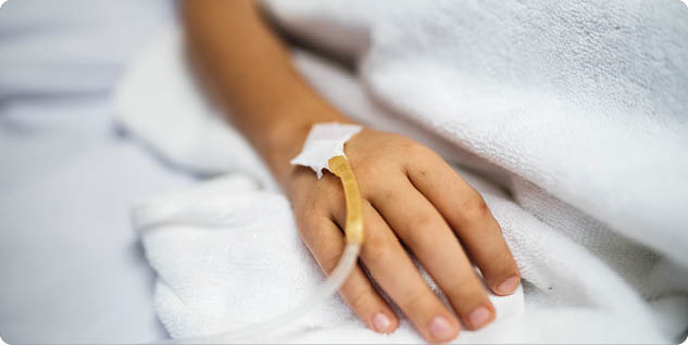 Closeup of hand with IV tube